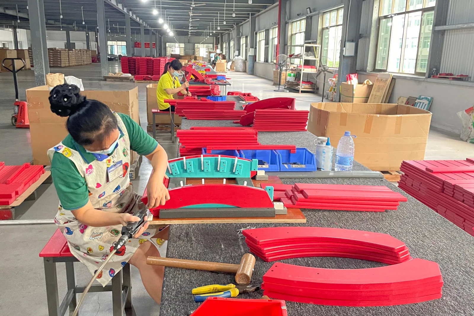Hand finishing outdoor chair components at Meisen