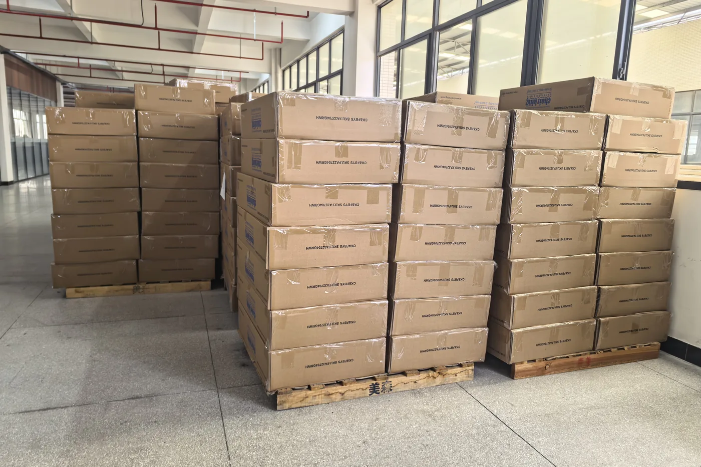 Packed outdoor furniture staged in Meisen's warehouse