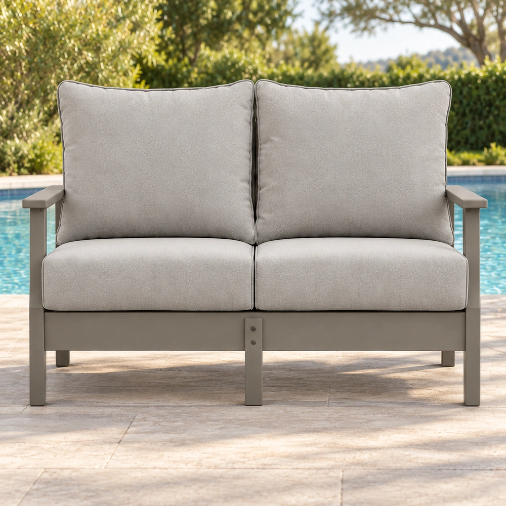 Two-seat cushioned HDPE outdoor sofa by a swimming pool, front view