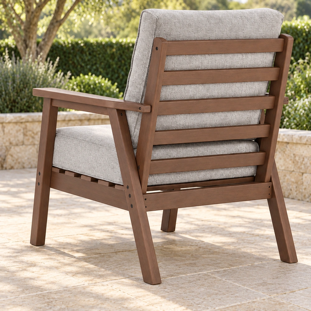 Rear-right view of brown cushioned HDPE outdoor lounge armchair on a sheltered garden patio