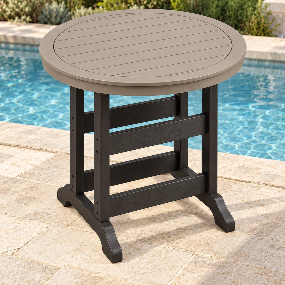 Elevated front-left view on a poolside limestone terrace of the round trestle-base HDPE bar table