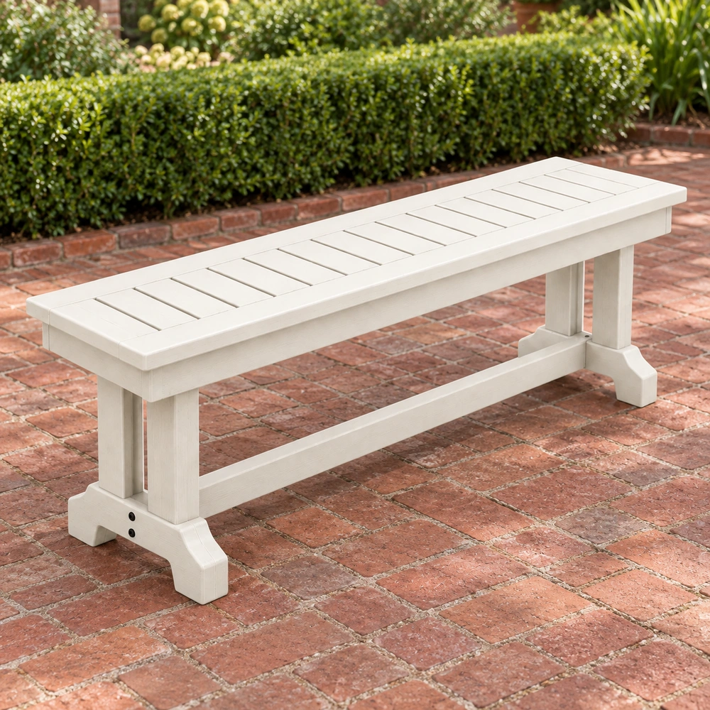 Reverse left-oblique view in a brick courtyard of the HDPE backless outdoor dining bench