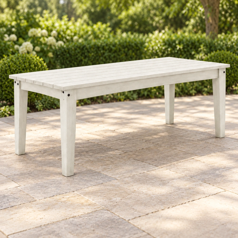 Front-left view on an open garden terrace of the white HDPE outdoor dining table
