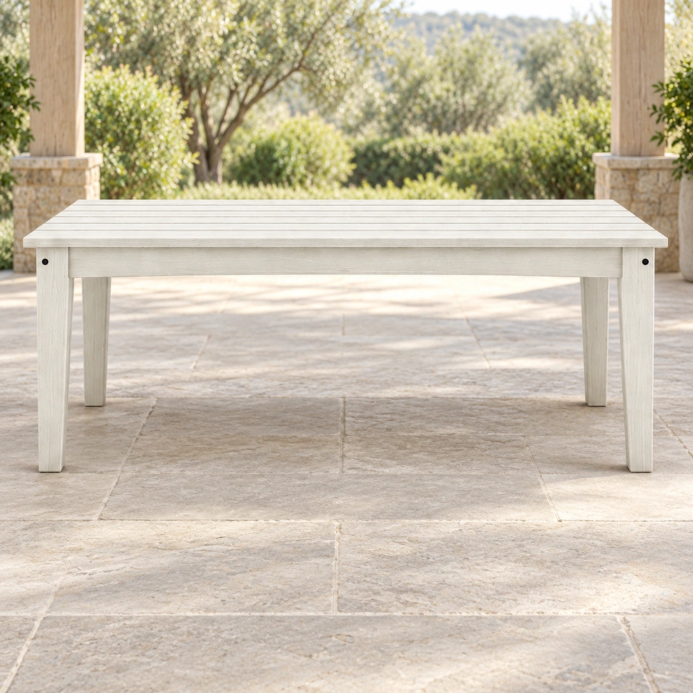 Straight long-side view under a covered garden veranda of the white HDPE outdoor dining table