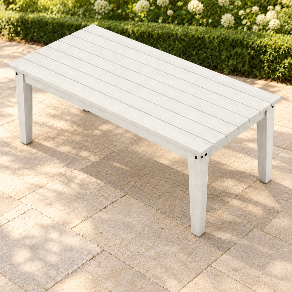 Elevated front-right view on an open garden patio of the white HDPE outdoor dining table